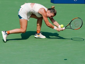 Number one seeded Simona Halep of Romania chases down a return to Kaia Kanepi of Estonia during their 2018 US Open women's match August 27, 2018 in New York.