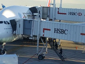 An Emirates Airbus 380 awaits at a gate at New York's Kennedy Airport.