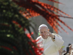 Pope Francis salutes as he arrives for his weekly general audience, at the Vatican, Wednesday, Aug. 29, 2018.