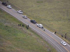 Police investigate the scene of a shooting along Highway 1A near Morley, Alta., in this August 2018 police handout photo.