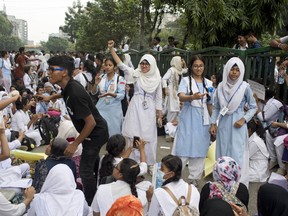 Bangladeshi students shout slogans and block a road during a protest in Dhaka, Bangladesh, Saturday, Aug. 4, 2018. Five days of protests by tens of thousands of students angry over the traffic deaths of two of their colleagues have largely cut off the capital Dhaka from the rest of Bangladesh, as the demonstrators pressed their demand for safer roads.