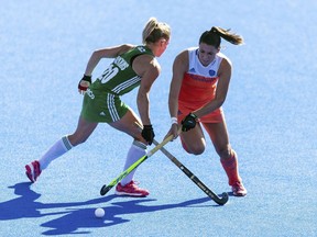 Netherlands' Malou Pheninckx , rightand Ireland's Chloe Watkins vie for the puck during the Women's Hockey World Cup Final match between the Netherlands and Ireland, at The Lee Valley Hockey and Tennis Centre, in London, Sunday Aug. 5, 2018.