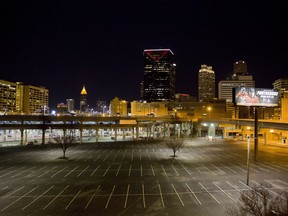 FILE- In this Jan. 24, 2018 file photo, an area known as "The Gulch," made up of parking lots and railroad lines, is seen against the downtown skyline in Atlanta. As Amazon.com prepares to select its site for a second headquarters, Atlanta leaders want to know more about plans for a colossal development project downtown. Atlanta city council members want to know how much public money will be spent to develop an underused site known as "The Gulch."