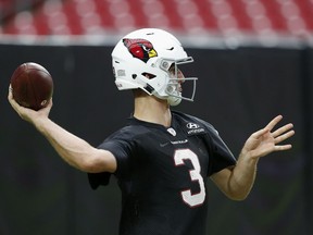 Arizona Cardinals quarterback Josh Rosen warms up during an NFL football practice Monday, Aug. 13, 2018, in Glendale, Ariz.