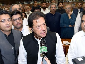 In this photo released by the National Assembly, the leader of Pakistan Tahreek-e-Insaf party Imran Khan,speaks at the National Assembly in Islamabad, Pakistan, Friday, Aug. 17, 2018. Pakistani lawmakers on Friday elected former cricket star and longtime politician Khan as the country's next prime minister in a step toward third straight transfer of power from one civilian government to another one. (National Assembly, via AP)