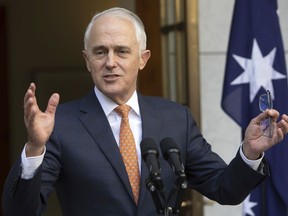 FILE - In this Friday, Aug. 24, 2018, file photo, outgoing Australian Prime Minister Malcolm Turnbull speaks during his final press conference before leaving Parliament in Canberra. Turnbull has resigned from Parliament, triggering a by-election that could bring down the unpopular conservative government.