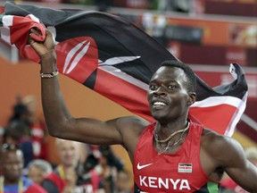 FILE - In this Tuesday, Aug. 25, 2015, file photo, Kenya's Nicholas Bett celebrates after winning the men's 400m hurdles final at the World Athletics Championships at the Bird's Nest stadium in Beijing. The ex-hurdles world champion Bett, 28, has been killed in a road accident. Nandi county police commander Patrick Wambani says Bett was killed in the car crash early Wednesday morning near Kenya's high-altitude training region of Eldoret. Bett's coach Vincent Mumo says the athlete's SUV hit bumps in a road and rolled.