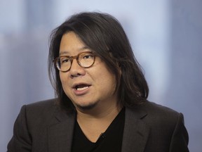 FILE - In this Friday, Aug. 25, 2017, photo, Singaporean novelist Kevin Kwan talks during an interview in Hong Kong. The Singaporean government says that Kwan, author of the book that inspired the hit film "Crazy Rich Asians," failed to register for national service as required. Kwan left Singapore when he was 11 and has lived in the United States since then.