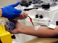 Plasma is taken from a donor at a Canadian Blood Services clinic in Edmonton in March, 2011.