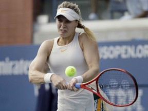 Eugenie  Bouchard of Westmount, Que. hits a return against Manketa Vondrousova of the Czech Republic during second-round action at the U.S. Open Thursday in New York. Bouchard lost the match in straight sets, 6-4 and 6-3.