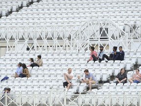 Spectators watch the fifth day of the third cricket test match between England and India at Trent Bridge in Nottingham, England, Wednesday, Aug. 22, 2018.