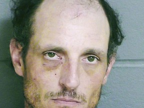 This booking photo released by the Dover, N.H., Police Department shows Jeramie Colella. He is charged with second-degree murder in the deaths of his wife and father, whose bodies were found at a home in Dover on Monday, Aug. 20, 2018. (Dover Police Department via AP)