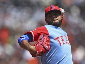 Texas Rangers pitcher Martin Perez works against the San Francisco Giants in the first inning of a baseball game Saturday, Aug. 25, 2018, in San Francisco.
