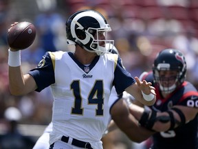 Los Angeles Rams quarterback Sean Mannion passes against the Houston Texans during the first half in an NFL preseason football game Saturday, Aug. 25, 2018, in Los Angeles.
