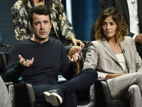 Ron Livingston, left, a cast member in the Disney ABC television series "A Million Little Things," answers a question as fellow cast member Stephanie Szostak looks on during the 2018 Television Critics Association Summer Press Tour, Tuesday, Aug. 7, 2018, in Beverly Hills, Calif.