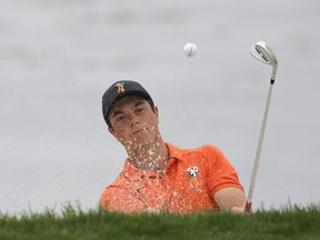 Viktor Hovland, of Norway, follows his shot out of a bunker up to the 18th green of the Pebble Beach Golf Links during the final round of the USGA Amateur Golf Championship against Devon Bling, Sunday, Aug. 19, 2018, in Pebble Beach, Calif.