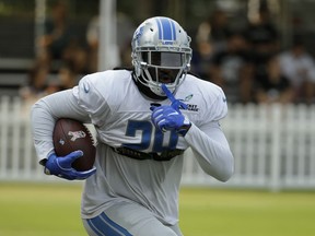 Detroit Lions running back LeGarrette Blount runs with the ball during NFL football practice Tuesday, Aug. 7, 2018, in Napa, Calif. The Oakland Raiders and the Lions held a joint practice before their upcoming preseason game on Friday.