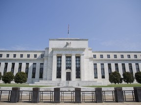 FILE - This Wednesday, Aug. 2, 2017, file photo shows the Federal Reserve Building on Constitution Avenue in Washington. The Federal Reserve is likely to point to strong growth in the economy, low unemployment and rising inflation as reasons to keep on its current path of gradually raising interest rates. The Fed's statement at the end of its two-day meeting will be released Wednesday afternoon, Aug. 1, 2018, in the form of a brief policy statement.