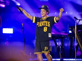 FILE - In this May 27, 2018 file photo, Bruno Mars performs at the Bottle Rock Napa Valley Music Festival at Napa Valley Expo in Napa, Calif. Cardi B may have backed out of the Bruno Mars tour, but he's found four other acts to hit the road with him. Mars announced Tuesday, Aug. 14, 2018, that Boyz II Men, Charlie Wilson, Ciara and "Boo'd Up" singer Ella Mai will perform during his upcoming fall concerts on his 24K Magic World Tour.