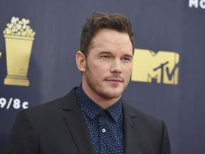 FILE - In this June 16, 2018 file photo, Chris Pratt arrives at the MTV Movie and TV Awards at the Barker Hangar in Santa Monica, Calif. Pratt says "it's not an easy time" as he and the rest of the "Guardians of the Galaxy" cast look to the future of the hit superhero franchise after Disney fired writer-director James Gunn. Pratt told The Associated Press in an interview Tuesday, Aug. 14, 2018, that he stands behind social media posts saying he hopes Gunn can be reinstated for the next movie.