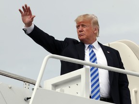 FILE - In this Tuesday, Aug. 21, 2018, file photo, President Donald Trump waves as he boards Air Force One at Andrews Air Force Base, Md., en route to West Virginia for a rally. Trump has been accused of dishonesty, spreading falsehoods, misrepresenting facts, distorting news, passing on inaccuracies and being loose with the truth. But does he lie? News organizations generally resist using the word because it requires them to judge a person's intent.
