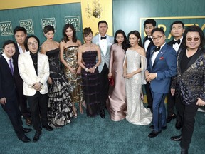 The cast and crew of "Crazy Rich Asians arrive at the film's premiere at the TCL Chinese Theatre on Tuesday, Aug. 7, 2018, in Los Angeles.
