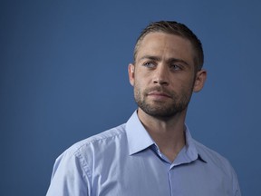 In this Wednesday, Aug. 8, 2018 photo, Cody Walker, Paul Walker's brother, poses for a portrait in Los Angeles, in promotion of the documentary film "I Am Paul Walker."  Nearly five years after Paul Walker's death, his brothers, Caleb and Cody Walker, say they're open to playing his character again in the "Fast and Furious" franchise.