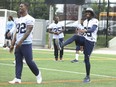 Toronto Argos wide receiver Duron Carter (right) stretches at practice on Aug. 29.