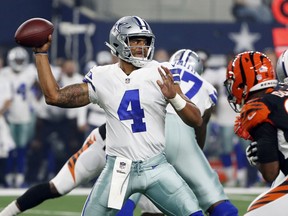 Dallas Cowboys quarterback Dak Prescott (4) looks to throw against the Cincinnati Bengals during the first half of a preseason NFL Football game in Arlington, Texas, Saturday, Aug. 18, 2018.