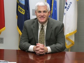 FILE - In this March 29, 2010, file photo, Wisconsin Emergency Management Administrator Ed Wall poses for a photo in Madison, Wis., days before taking over as the state Justice Department's Division of Criminal Investigation. Wall, the former Wisconsin prisons secretary, says in a new book that Gov. Scott Walker and Attorney General Brad Schimel drove him to the brink of suicide. Walker appointed Wall prison secretary in 2012. Wall resigned in 2016 amid allegations of widespread abuse at the state's youth prison.