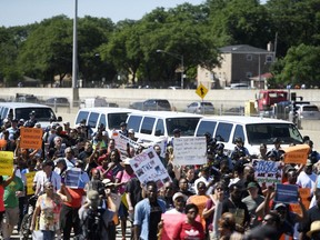 FILE - In this July 7, 2018, photo, protesters march on the Dan Ryan Expressway in Chicago. The protesters shut down the expressway in an attempt to increase pressure on public officials to address the gun violence that's claimed hundreds of lives in some of the city's poorest neighborhoods. Chicago officials have issued parking bans and are warning motorists of rolling street closures ahead of a rush-hour protest march along the city's always busy Lake Shore Drive. Protesters plan to gather on the thoroughfare Thursday afternoon, Aug. 2 and march north toward Wrigley Field.