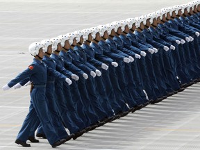 In this file photo taken on September 9, 2009 Members of China's Air Force battalion march as they rehearse for the National Day parade in Beijing. - Chinese bombers are likely training for strikes against US and allied targets in the Pacific, according to a new Pentagon report that also details how Beijing is transforming its ground forces to "fight and win."