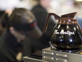 Freshly brewed coffee sits on a hot plate in a Tim Hortons outlet in Oakville, Ont. on Monday September 16, 2013. Tim Hortons closed four more American locations, as the coffee-and-doughnut chain struggles to overcome franchisee discontent and souring public opinion.