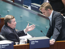 Toronto Mayor John Tory chats with Councillor Joe Cressy in at a city council meeting on Aug. 20, 2018.