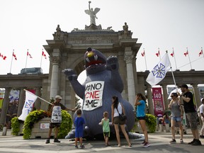 Picketing workers from the International Alliance of Theatrical Stage Employees (IATSE) walk the picket line in front of the Canadian National Exhibition on Sunday, August 19, 2018.