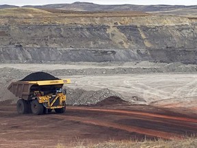 FILE - In this March 28, 2017 file photo, a dump truck hauls coal at Contura Energy's Eagle Butte Mine near Gillette, Wyo. A conservation group wants a  federal judge to disband a Trump administration energy advisory panel that is reviewing royalty payments made by companies that extract fuel from public lands.
