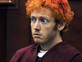 FILE - In this July 23, 2012, file photo, James Holmes, who was convicted of killing 12 moviegoers and wounding 70 more in a shooting spree in a crowded theatre in 2012, sits in Arapahoe County District Court in Centennial, Colo. In a new book and an interview with The Associated Press, psychiatrist William H. Reid, who spent hours talking with Holmes, says what led Holmes to open fire was a vortex of his mental illness, his personality and his circumstances, along with other, unknown factors.