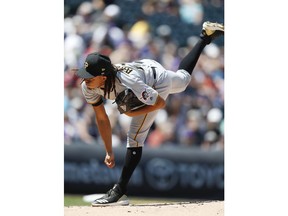 Pittsburgh Pirates starting pitcher Chris Archer works against the Colorado Rockies in the first inning of a baseball game Wednesday, Aug. 8, 2018, in Denver.