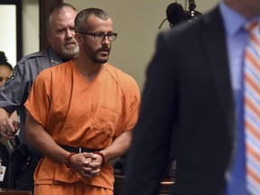 FILE - In this Aug. 16, 2018, file photo, Christopher Watts is escorted into the courtroom before his bond hearing at the Weld County Courthouse in Greeley, Colo. Charges were filed Monday, Aug. 20, 2018, against 33-year-old Watts in the deaths of his pregnant wife and their two young daughters.