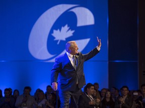 Ontario Premier Doug Ford acknowledges the crowd before speaking at the Conservative national convention in Halifax on Thursday, August 23, 2018.