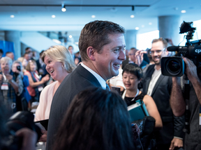 Conservative leader Andrew Scheer is greeted by supporters at the Party's national convention in Halifax on Aug. 23, 2018.