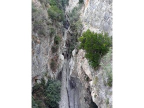A view of the Raganello Gorge in Civita, Italy, Monday, Aug. 20, 2018. Italy's civil protection agency says at least five people have been killed when a rain-swollen river flooded a gorge in the southern region of Calabria. The Italian news agency ANSA reported Monday that 12 people were brought to safety in the flash flood. It was unclear how many people were missing. The flood hit a group of hikers in the Raganello Gorge.