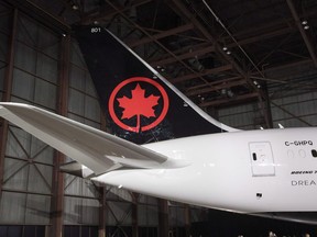 The tail of the newly revealed Air Canada Boeing 787-8 Dreamliner aircraft is seen at a hangar at the Toronto Pearson International Airport in Mississauga, Ont., Thursday, February 9, 2017. A consortium including Air Canada, TD Bank, CIBC and Visa Canada Corp. have reached a deal to acquire the Aeroplan loyalty program from Aimia Inc.