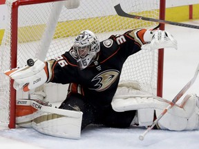 Anaheim Ducks goaltender John Gibson blocks a San Jose Sharks shot during the third period of Game 2 in an NHL hockey first-round playoff series in Anaheim, Calif., Saturday, April 14, 2018. Gibson has agreed to an eight-year, $51.2 million contract extension with the Ducks.