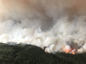 The South Stikine River fire burns in an Aug.6, 2018 handout photo provided by the BC Wildfire Service. The BC Wildfire Service says its priority is to protect homes and properties in a northwestern B.C. community already hammered by a wildfire. THE CANADIAN PRESS/HO-BC Wildfire Service MANDATORY CREDIT