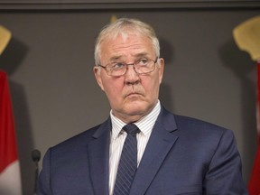 Bill Blair, federal minister of border security and organized crime reduction, attends a press conference in Toronto on Friday, August 3, 2018. Canada's minister of border security and organized crime reduction says Ottawa will consider a resolution passed by police chiefs urging the federal government to beef up its fight against the scourge of opioids by more closely vetting people who import pill presses.