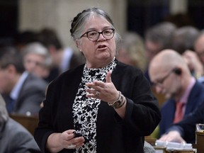 Minister of National Revenue Diane Lebouthillier rises during Question Period in the House of Commons on Parliament Hill in Ottawa on Monday, Feb. 26, 2018. The federal government is appealing an Ontario court ruling striking down limits on the political activities of charities at the same time as it says it will introduce legislation this fall to eliminate that same limit. Canada Revenue Minister Diane Lebouthillier says there were significant errors of law in the decision that require an appeal despite the legislative plans.THE CANADIAN PRESS/Justin Tang