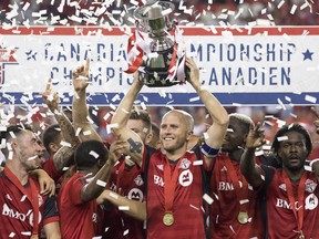 Fresh from another successful Canadian Championship title defence, Toronto FC returns to the grind of trying to claw its way into the Major League Soccer playoff picture on Saturday at San Jose. Toronto FC captain Michael Bradley lifts the Voyageurs Cup after beating Vancouver Whitecaps 5-2 to win the Canadian Championship Final, in Toronto on Wednesday, August 15, 2018.