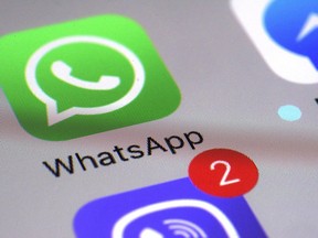 WhatsApp appears on a smartphone in New York, March 10, 2017. Police forces in two provinces are issuing warnings about a disturbing online challenge that encourages participants to complete dangerous tasks.Police in Sudbury Ont., and Gatineau Que., say parents should be warning their children not to engage in the so-called "Momo Challenge."