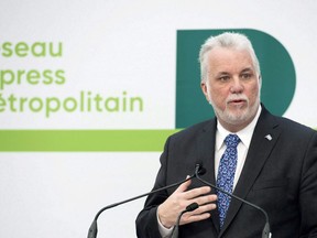 Quebec Premier Philippe Couillard speaks during a news conference in Montreal, Thusday, February 8, 2018, where he announced details of new automated light rail system for the Montreal region. A nascent federal agency designed to find new ways to finance construction of transit systems is making its first investment in a multi-billion-dollar electric rail system in Montreal.